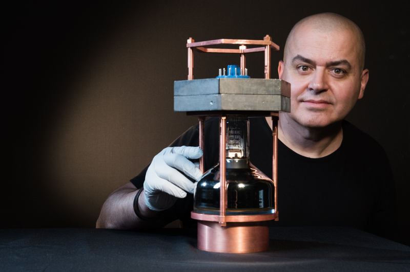 Collar with a model of the COHERENT detector (Image: Jean Lachat/UChicago)
